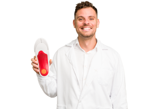 Young caucasian chiropodist man isolated happy, smiling and cheerful.