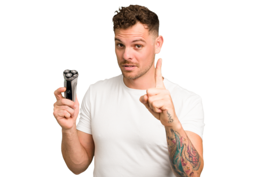 Young caucasian man holding a razor isolated having an idea, inspiration concept.