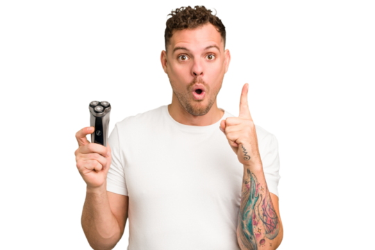 Young caucasian man holding a razor isolated having some great idea, concept of creativity.