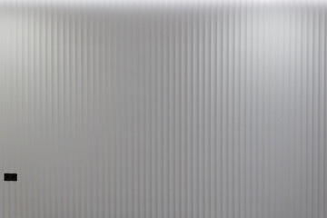 gray decorative wall with vertical stripes. photo for designers and desktop