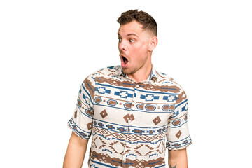 Young caucasian handsome man isolated being shocked because of something she has seen.