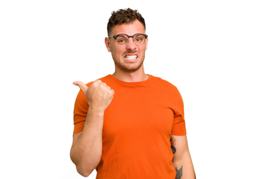 Young caucasian handsome man isolated shocked pointing with index fingers to a copy space.