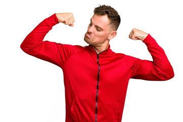 Young caucasian handsome man isolated showing strength gesture with arms, symbol of feminine power