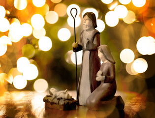Nativity Scene with Baby Jesus Mary and Joseph with Warm Golden Lights - obrazy, fototapety, plakaty