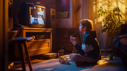 Young Boy Playing Eighties Eight Bit Arcade Video Game on a Console at Home in His Room with Old-School Interior. Child Successfully Wins the Level. Nostalgic Childhood Concept. - obrazy, fototapety, plakaty