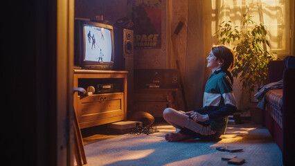 Nostalgic Retro Childhood Concept. Young Boy Watches Hockey Match on TV in His Room with Dated...