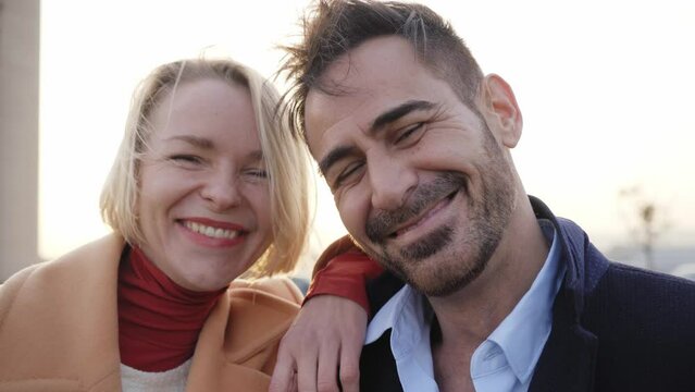 Cheerful middle-aged marriage taking a selfie looking at the camera. Smiling and happy couple having fun. Good memories of a couple relationship. Portrait of a wife and husband outdoors.