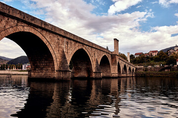 Fototapeta na wymiar Bridge on river Drina, famous historic Ottoman architecture in Visegrad, Bosnia and Herzegovina.