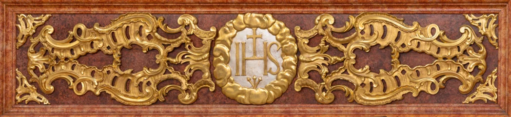 Tuinposter LUZERN, SWITZERLAND - JUNY 24, 2022: The carved polychrome relief of IHS initials of Jesus on the mensa of Jesuitenkirche from 17. cent. © Renáta Sedmáková