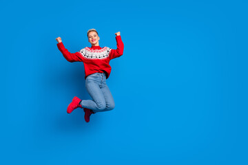 Fototapeta na wymiar Full body photo of nice overjoyed lady fists up wear red ugly sweater hooray final black friday sale xmas winter season isolated on blue color background