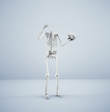 Skeleton holds his own head .