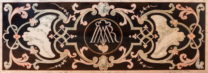 LUZERN, SWITZERLAND - JUNY 24, 2022: The stone baroque mosaic (pietra dura) of Marianic initials as...