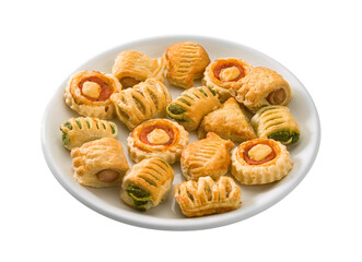Small pizzas, pretzels with meat and frankfurters, for aperitifs, on an isolated round white plate