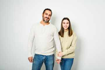Naklejka premium father and cute teen isolated on white on studio