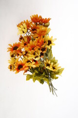 Bouquet of orange and yellow flowers against a white background