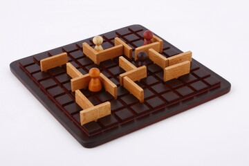 Abstract maze puzzle board game with pawns and obstacles