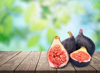 Fresh juicy ripe sweet figs fruit on background