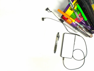 Flat lay,background mockup. the workspace in the background of the desk is white from the top view. layout space with mobile phones, books, pencils, stationery on a white desk background.