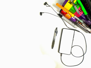 Flat lay,background mockup. the workspace in the background of the desk is white from the top view. layout space with mobile phones, books, pencils, stationery on a white desk background.