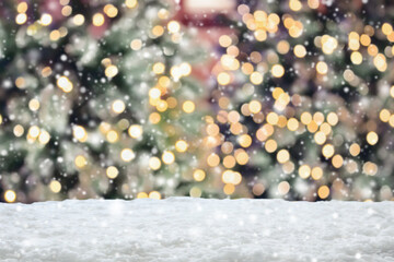 Empty white snow with blur Christmas tree with bokeh light background