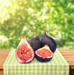 Fresh juicy ripe sweet figs fruit on natural background