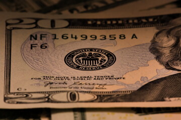 Closeup macro image of US 20 dollar bill and the Federal Reserve symbol - obrazy, fototapety, plakaty