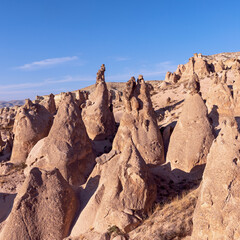 Unreal world of Cappadocia. Amazing hills in Cappadocia mountains. Traveling concept background