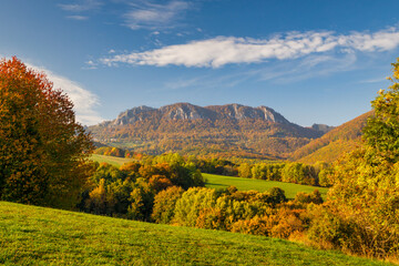 View of autumn landscape with rocky mountains in the background. The Vrsatec National Nature Reserve in the White Carpathian Mountains, Slovakia, Europe.