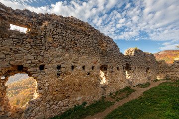 Stone wall of the ruins of the medieval Vrsatec castle. The Vrsatec National Nature Reserve in the...