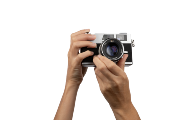 Female hands holding an old vintage camera with no background
