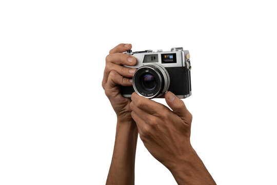 Male hands holding an old vintage camera with no background