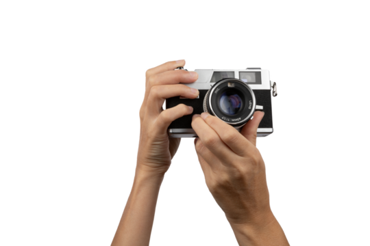 Female hands holding an old vintage camera with no background