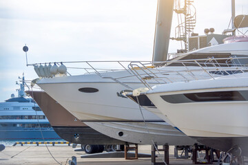 Stern nose of sea yachts and boats installed on special supports for storage and maintenance of ships in the docks.