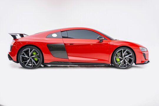 Modern Red Audi R8 Sport Plus in studio isolated on a white background
