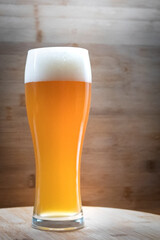 glass of beer on wooden table