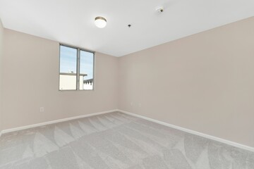 View of an empty room with beige walls - A house renovation scene