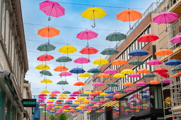 Colorful umbrellas hang in the pedestrian street, Trondheim, Norway June 3th 2022