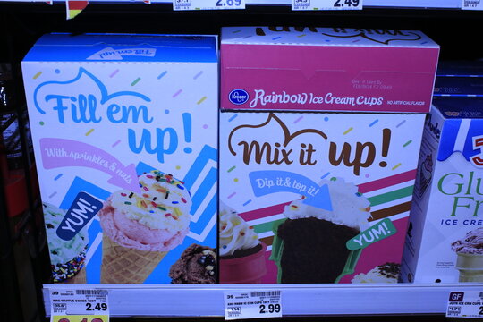 Ice Cream Cups In Boxes On A Shelf At A Grocery Store