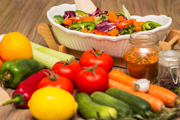 Healthy and fresh salad in bowl with vegetables and fruit
