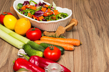 Healthy and fresh salad in bowl with vegetables and fruit