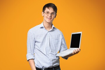 Nice happy young guy with laptop computer