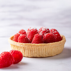 Tart with custard and fresh ripe raspberries