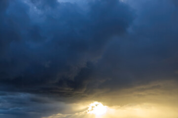 Obraz na płótnie Canvas Sunlight through the dark clouds