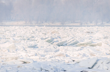 The bank of the Danube river covered with snow. Frozen, snow-covered banks of the Danube River below the Petrovaradin Fortress, Vojvodina, Novi Sad, Petrovaradin, Serbia.