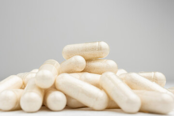 White medicine capsules, vitamin pills or drugs, medication treatment, health care concept