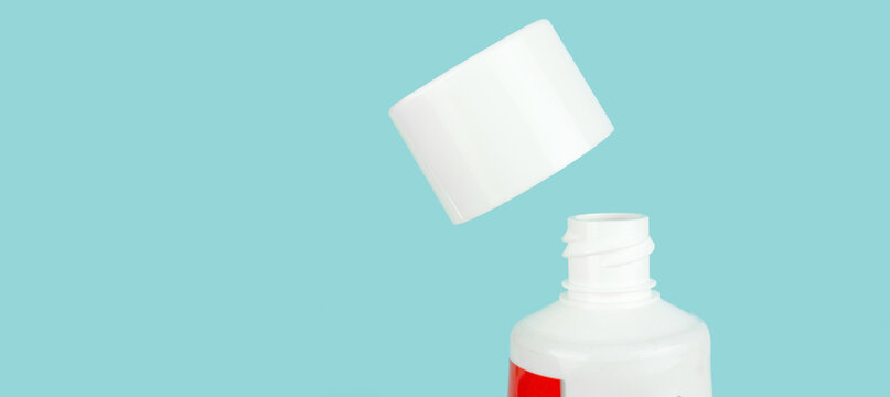 Top view toothpaste arranged on blue backdrop, dentistry concept. Concept of oral hygiene in the family.