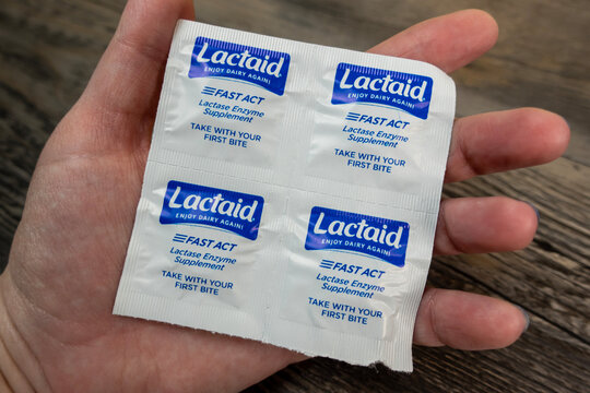 Seattle, WA USA - circa November 2022: Selective focus on Lactaid medicine in the palm of someone's hand.