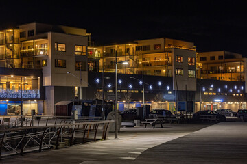 Fototapeta na wymiar Shopping center in Brønnøysund city.Light and colors in Brønnøysund harbor area, Nordland county, Norway, Europe 