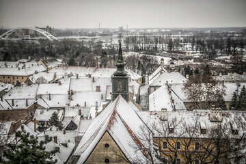 A panoramic view of Petrovaradin rooftops covered with snow