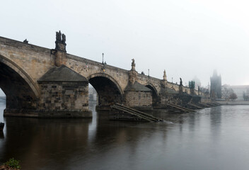 Fototapeta na wymiar Early foggy morning on Charles bridge Prague, Czech republic